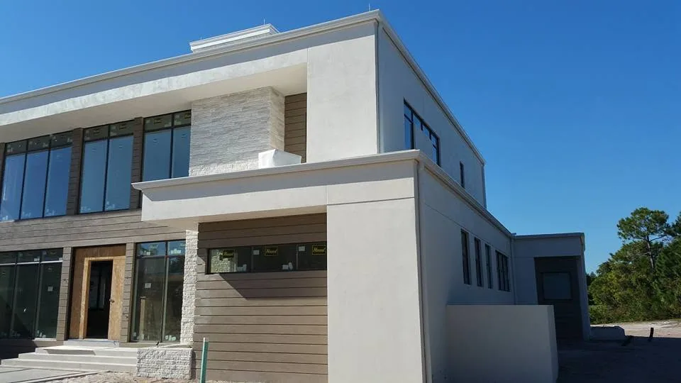 Flat roof modern commercial building white fascia gutter wood siding, Lake Mary